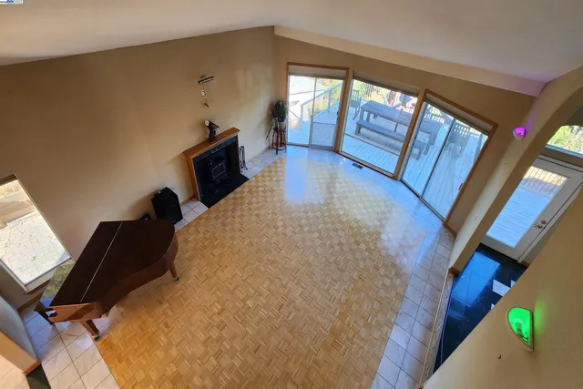 a view of an empty room with glass door