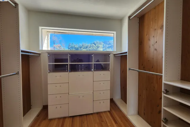 a kitchen with stainless steel appliances granite countertop a refrigerator and cabinets