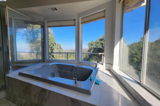 a kitchen with stainless steel appliances granite countertop a sink and a microwave