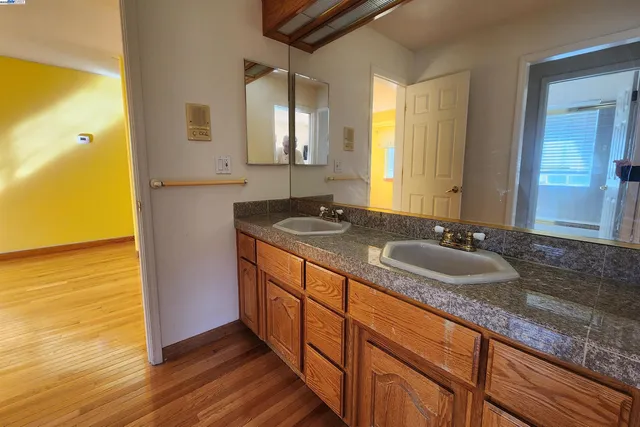 a living room with furniture a table and large windows