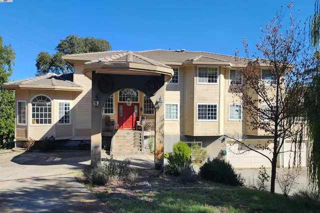 a view of living room and dining room with wooden floor