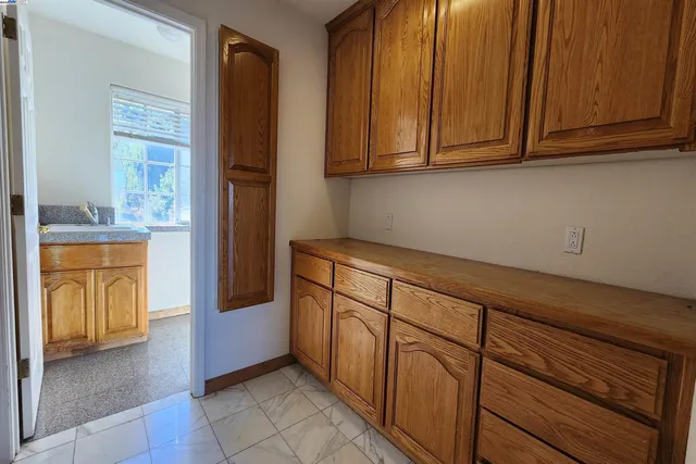 a view of a livingroom with furniture and a flat screen tv