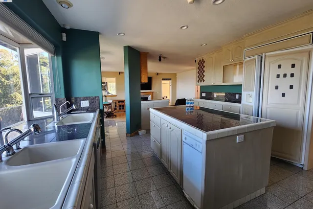 a living room with a couch and a wooden floor