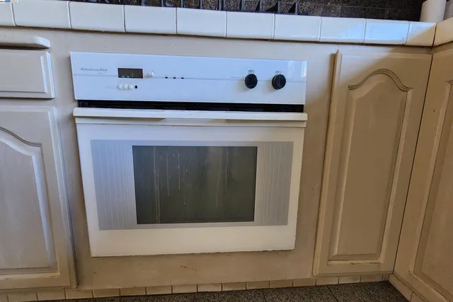 a bed room with a bed and a window