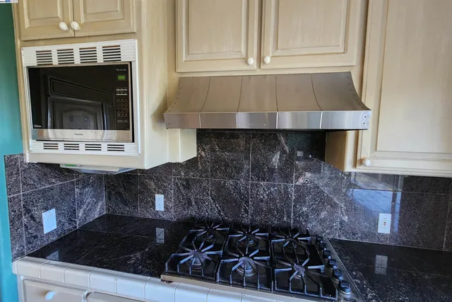 a bathroom with a sink a mirror and a shower
