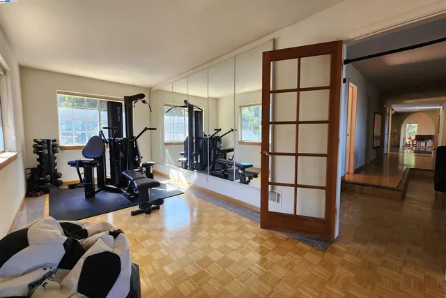 a view of a chairs and table in the balcony