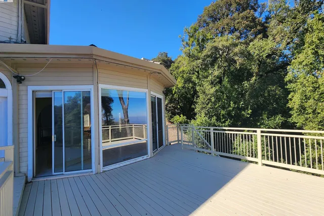a view of a hallway with wooden staircase