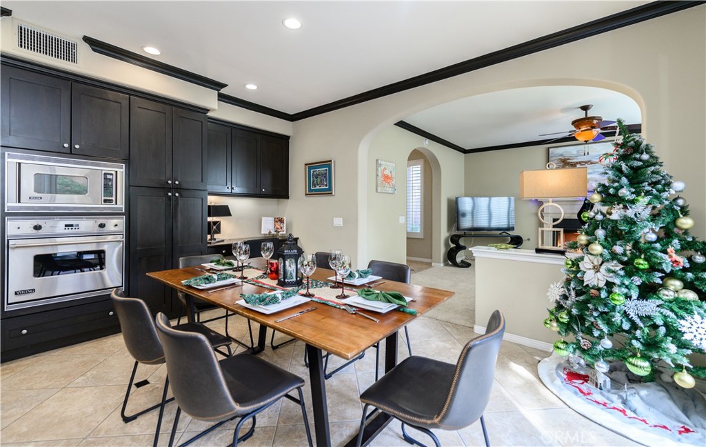 6 Inglenook Irvine, CA 92602 - Photo 12 of 59 a dining room with furniture and a kitchen