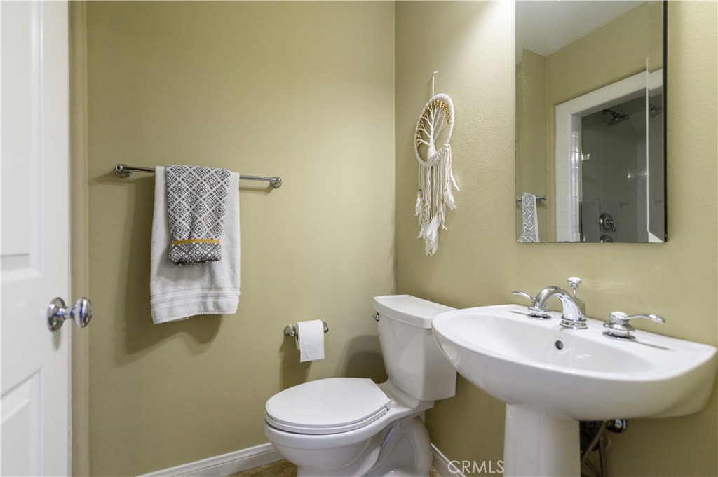 6 Inglenook Irvine, CA 92602 - Photo 20 of 59 a bathroom with a toilet sink and mirror