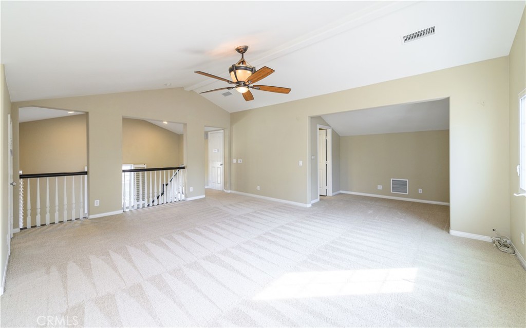 6 Inglenook Irvine, CA 92602 - Photo 44 of 59 a view of a bedroom with a chandelier fan and wooden floor
