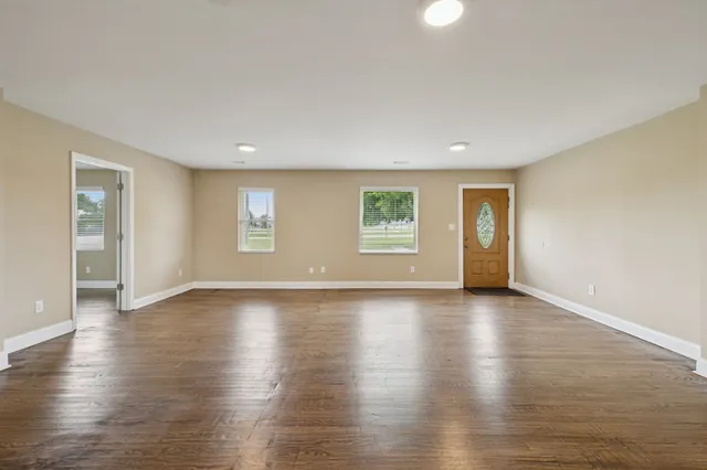 a kitchen with stainless steel appliances a refrigerator sink and cabinets