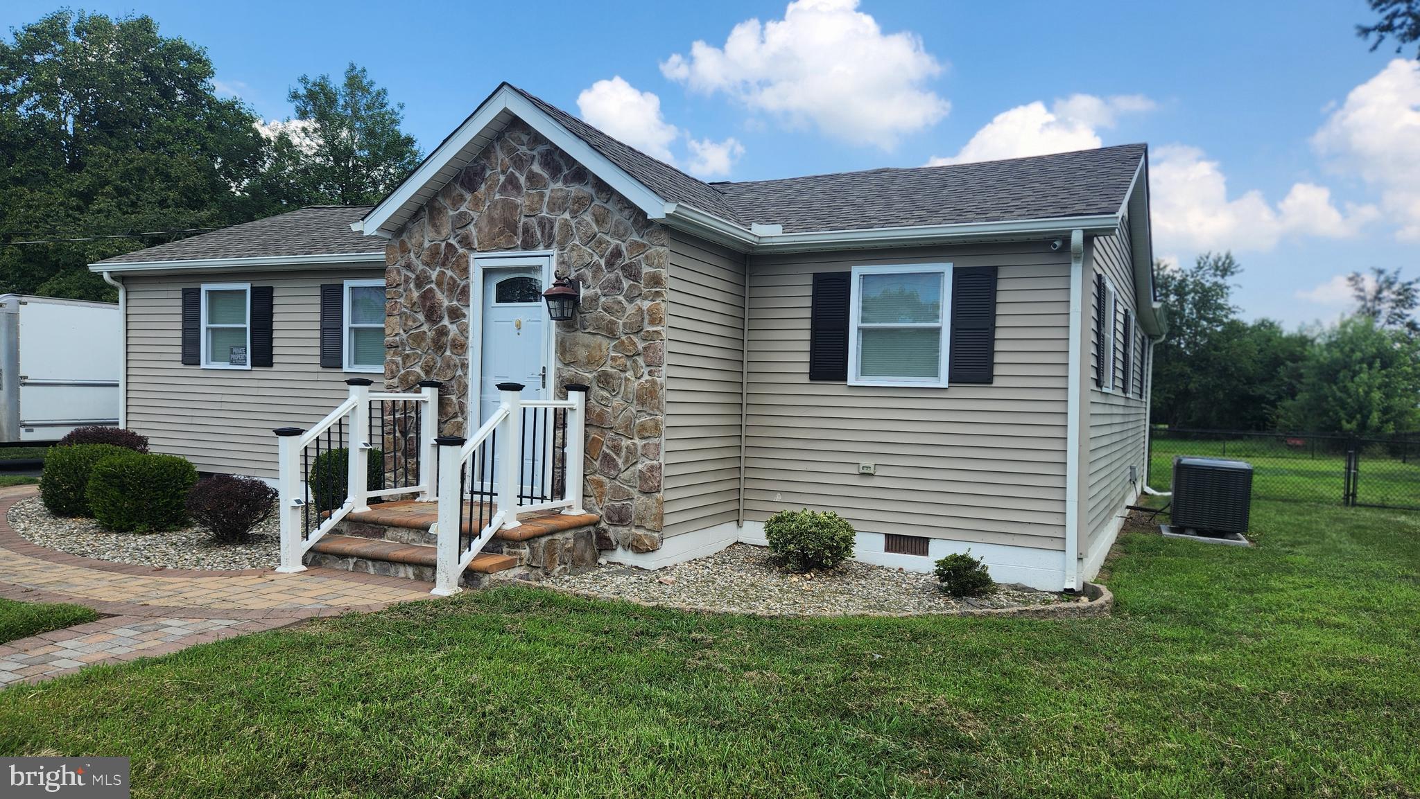 18601 Johnson Road Lincoln, DE 19960 - Photo 1 of 8 a front view of a house with a yard