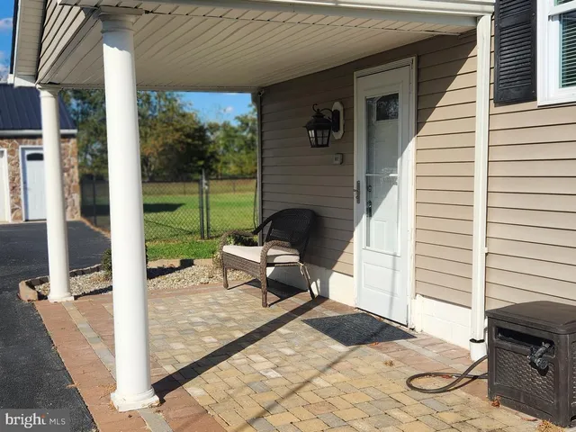 a view of a house with a yard and garage