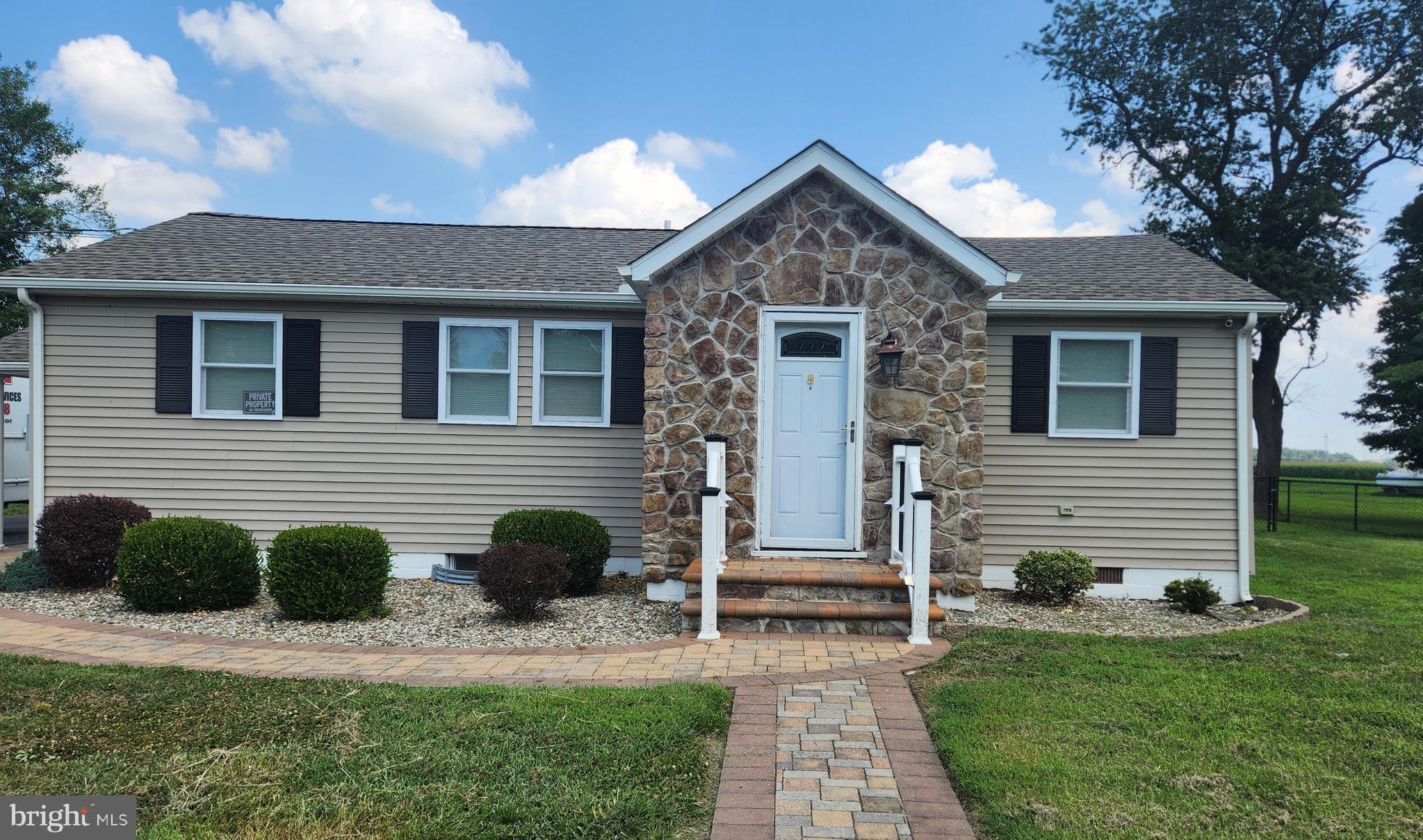 18601 Johnson Road Lincoln, DE 19960 - Photo 2 of 8 a front view of a house with a yard
