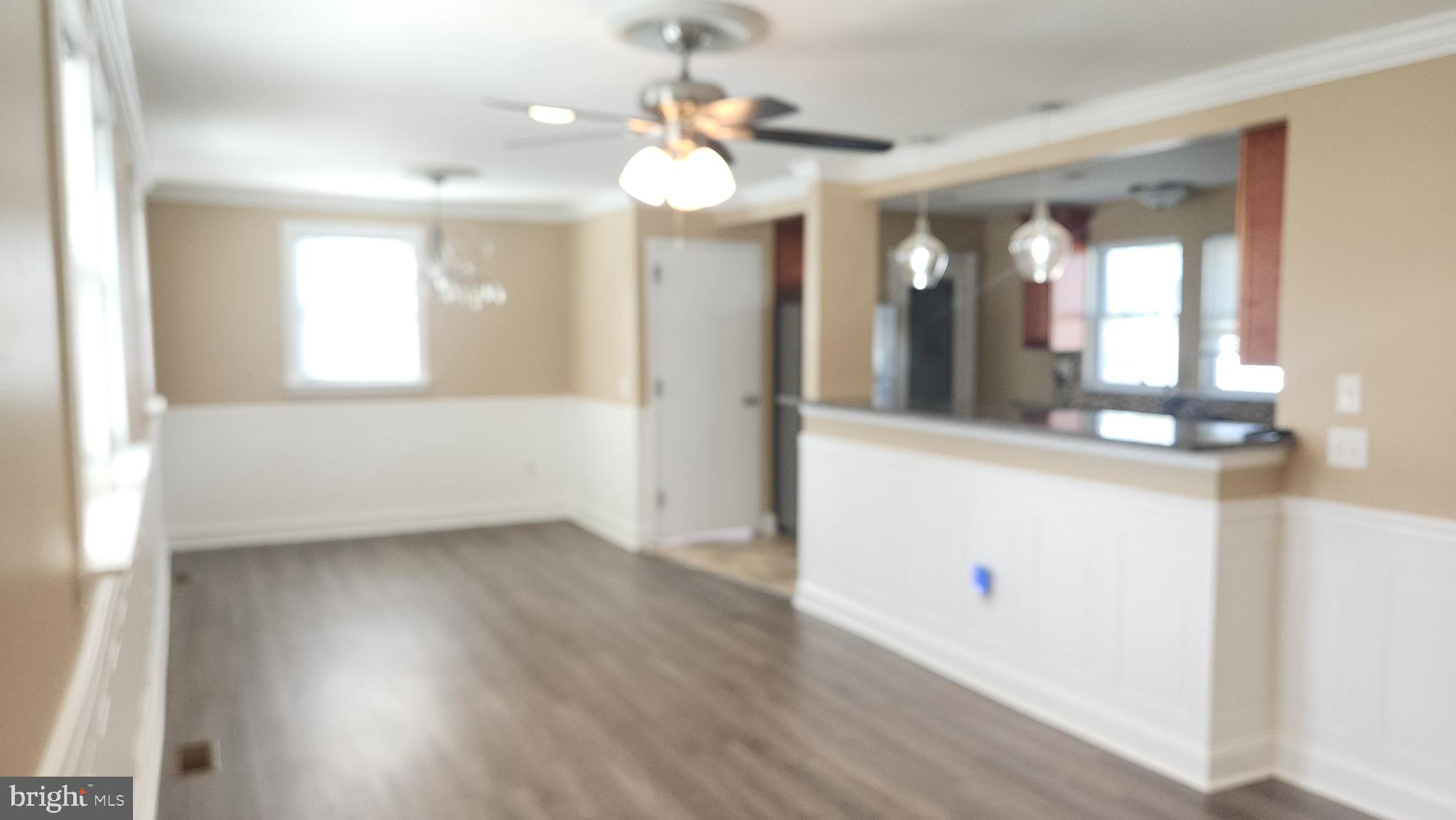 18601 Johnson Road Lincoln, DE 19960 - Photo 7 of 15 wooden floor in an empty room with a window