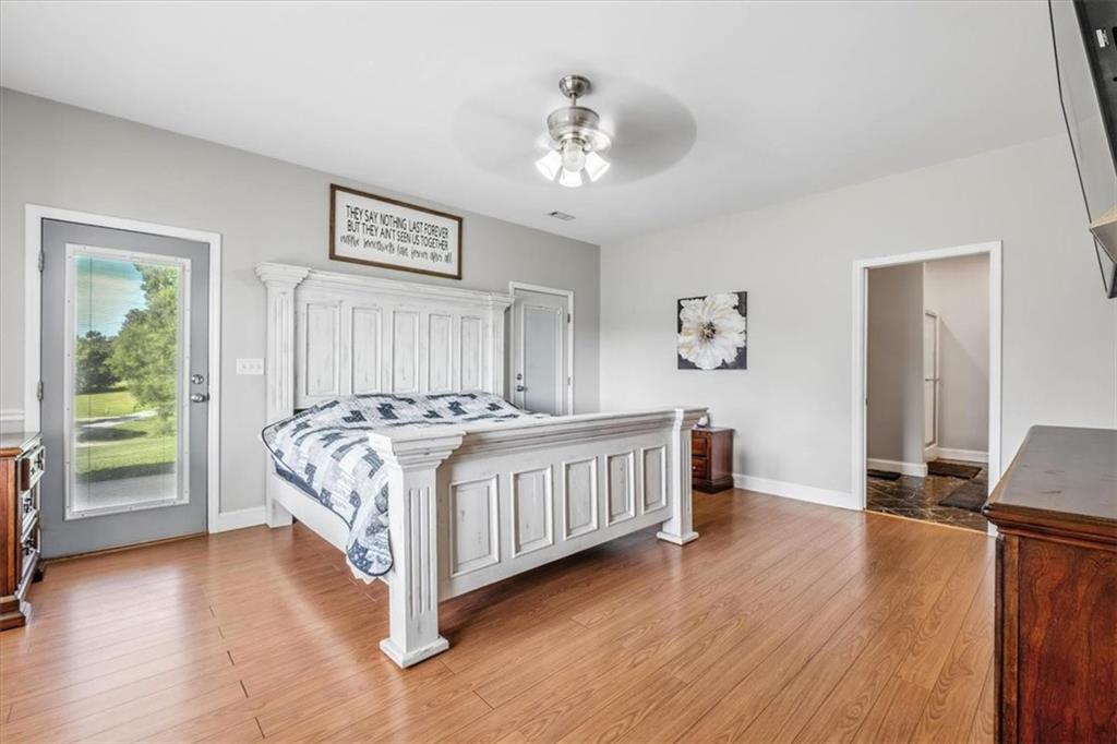 231 Gordon Road Cedartown, GA 30125 - Photo 19 of 49 a bedroom with a bed and a chandelier