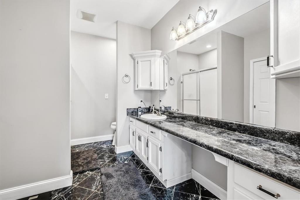 231 Gordon Road Cedartown, GA 30125 - Photo 21 of 49 a bathroom with a sink and a mirror
