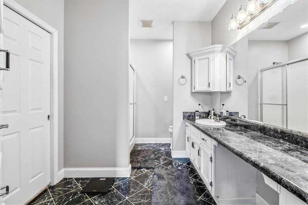 231 Gordon Road Cedartown, GA 30125 - Photo 22 of 49 a kitchen with granite countertop a sink stove and cabinets