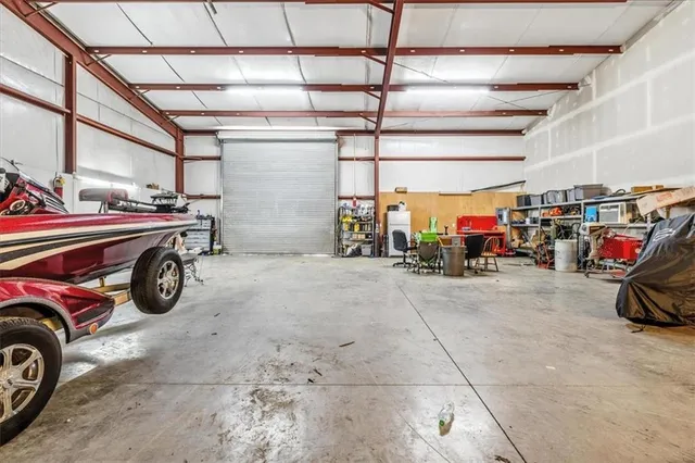 a view of parking garage with cars and other equipment
