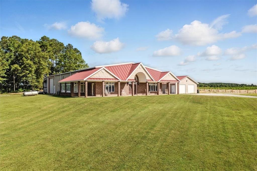 231 Gordon Road Cedartown, GA 30125 - Photo 44 of 49 a view of a house with a yard and sitting area