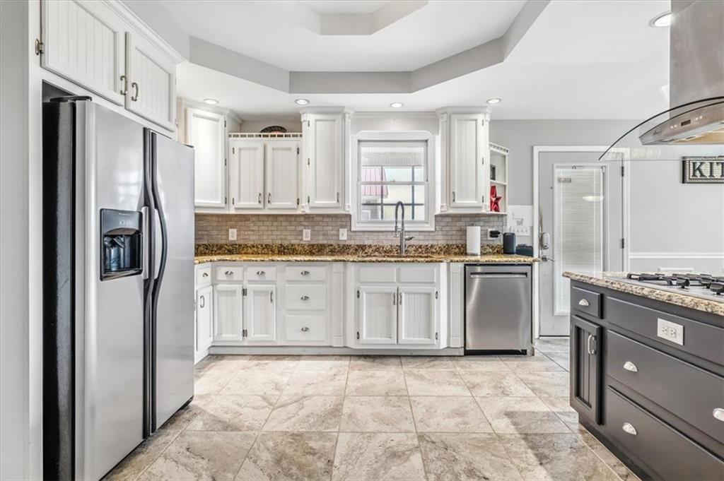 231 Gordon Road Cedartown, GA 30125 - Photo 5 of 49 a kitchen with granite countertop a refrigerator stove top oven and sink