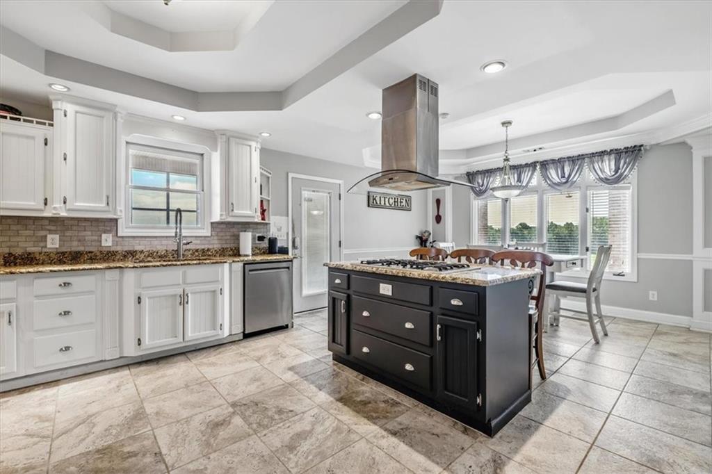 231 Gordon Road Cedartown, GA 30125 - Photo 6 of 49 a kitchen with a stove a sink and a refrigerator