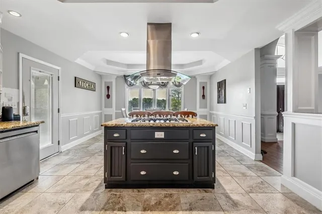 a spacious bathroom with a granite countertop sink a mirror and a shower