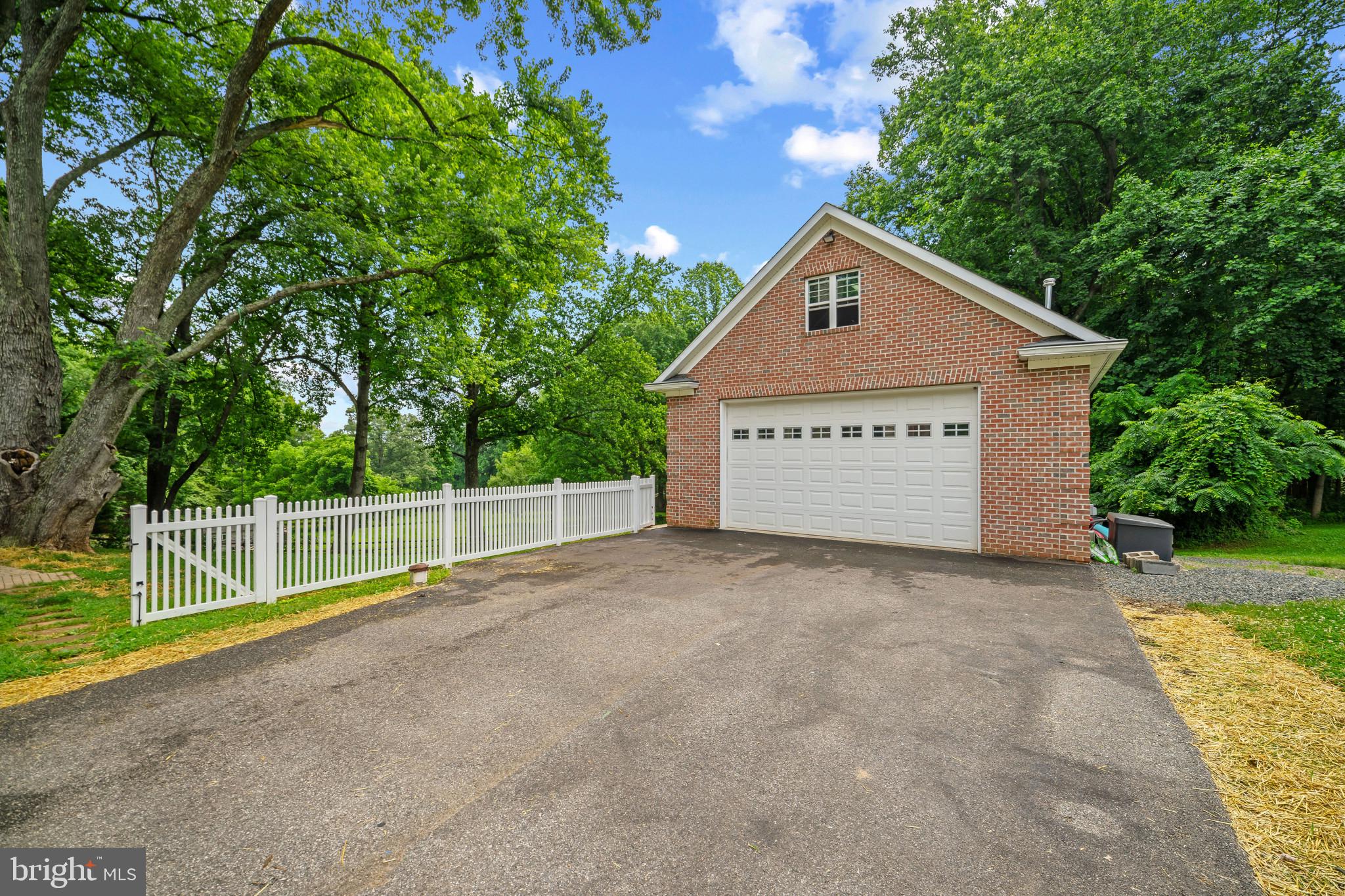 12221 Jerusalem Road Kingsville, MD 21087 - Photo 58 of 66 a view of garage with a small yard and a large tree