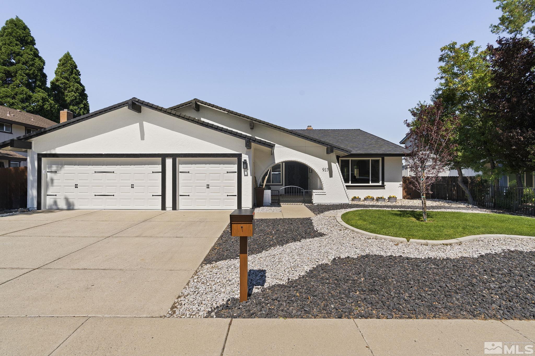 915 Pinebrook Road Reno, NV 89509 - Photo 1 of 29 a front view of a house with garden