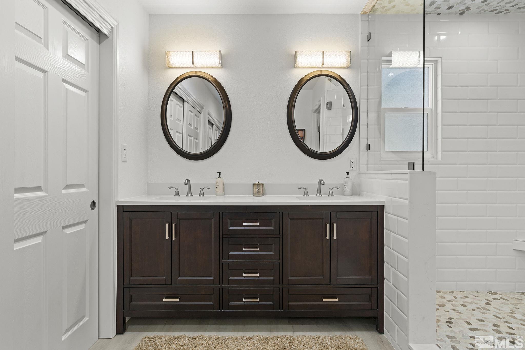915 Pinebrook Road Reno, NV 89509 - Photo 15 of 29 a bathroom with a sink and a mirror