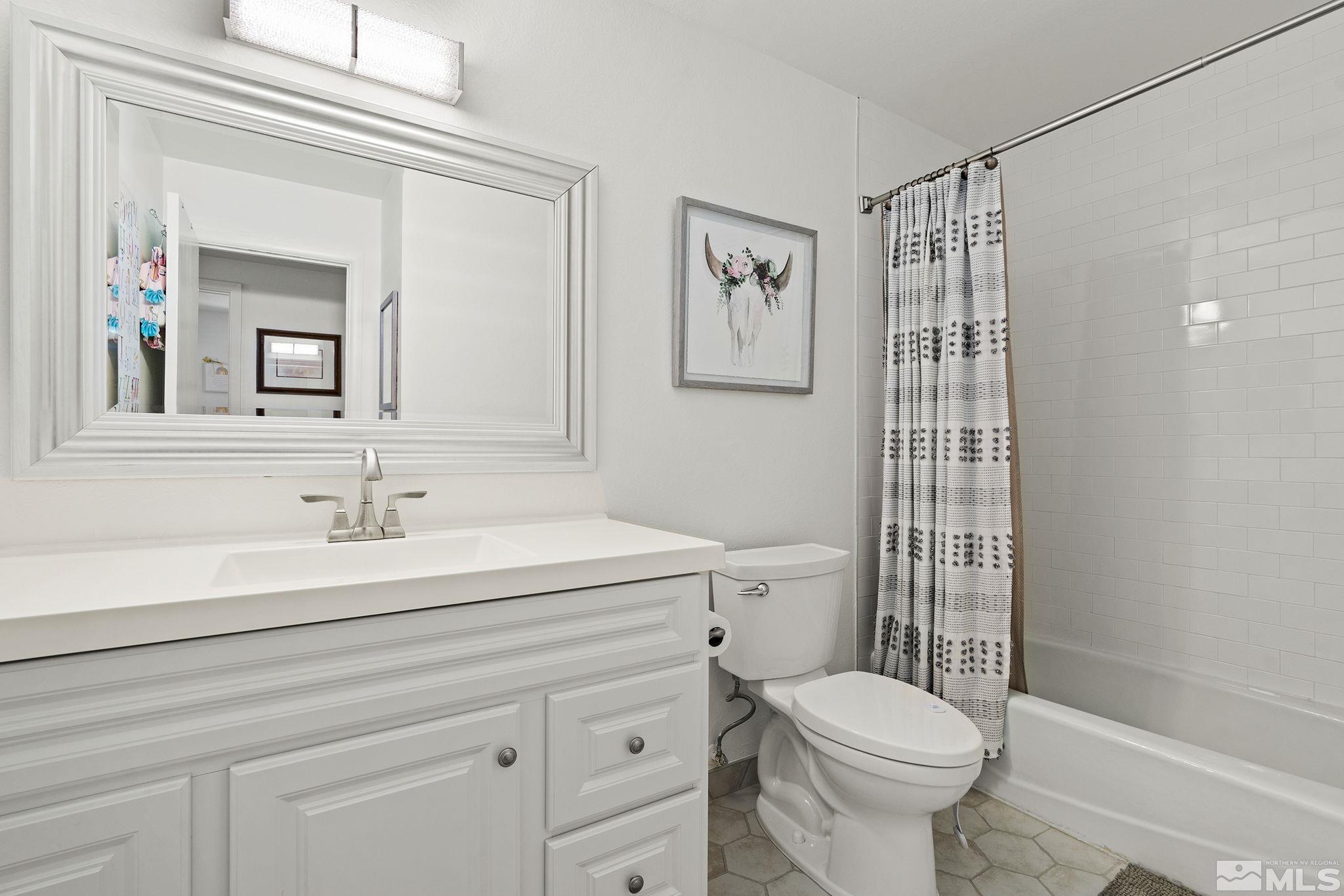 915 Pinebrook Road Reno, NV 89509 - Photo 20 of 29 a bathroom with a sink a toilet and shower