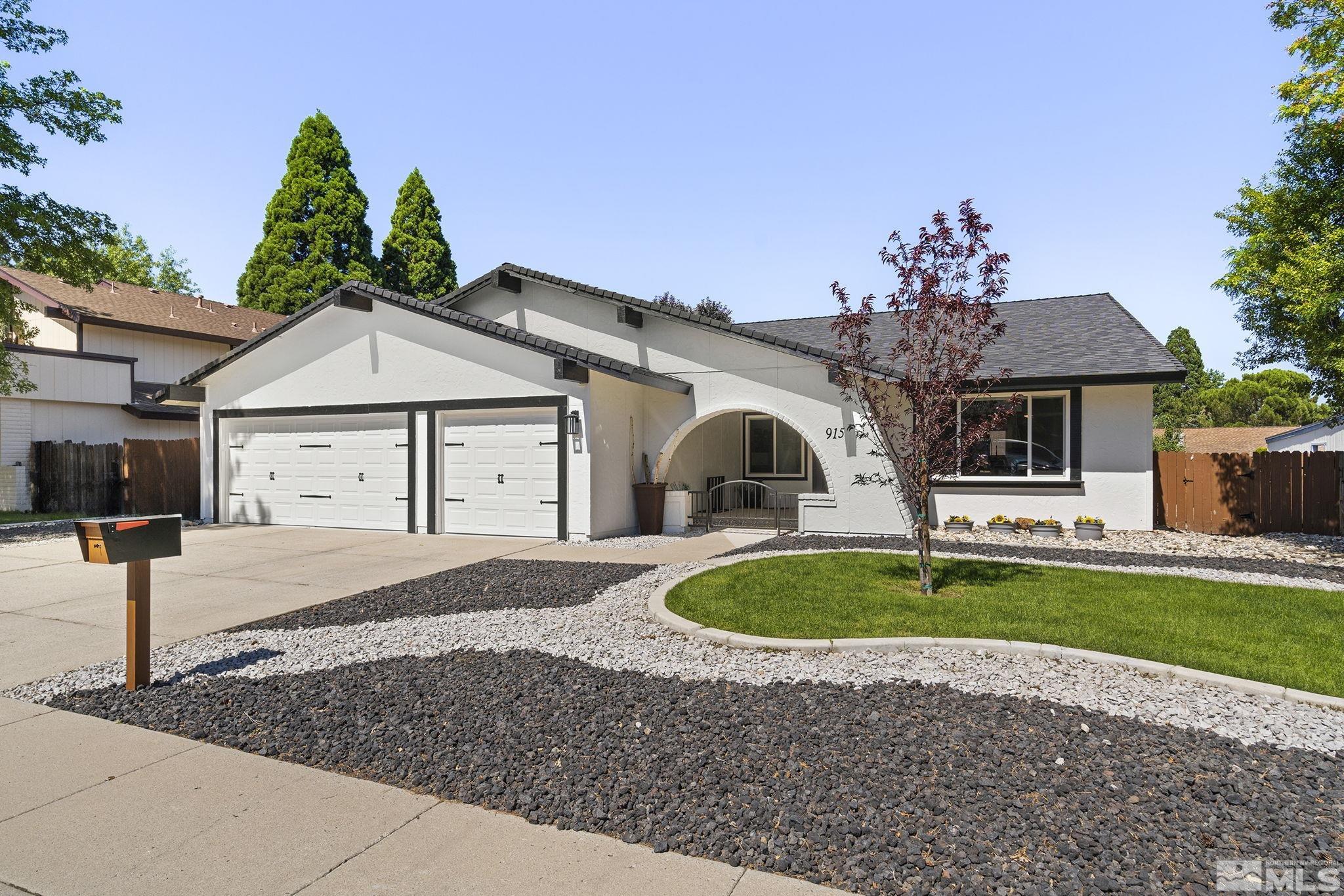 915 Pinebrook Road Reno, NV 89509 - Photo 2 of 29 a front view of a house with garden