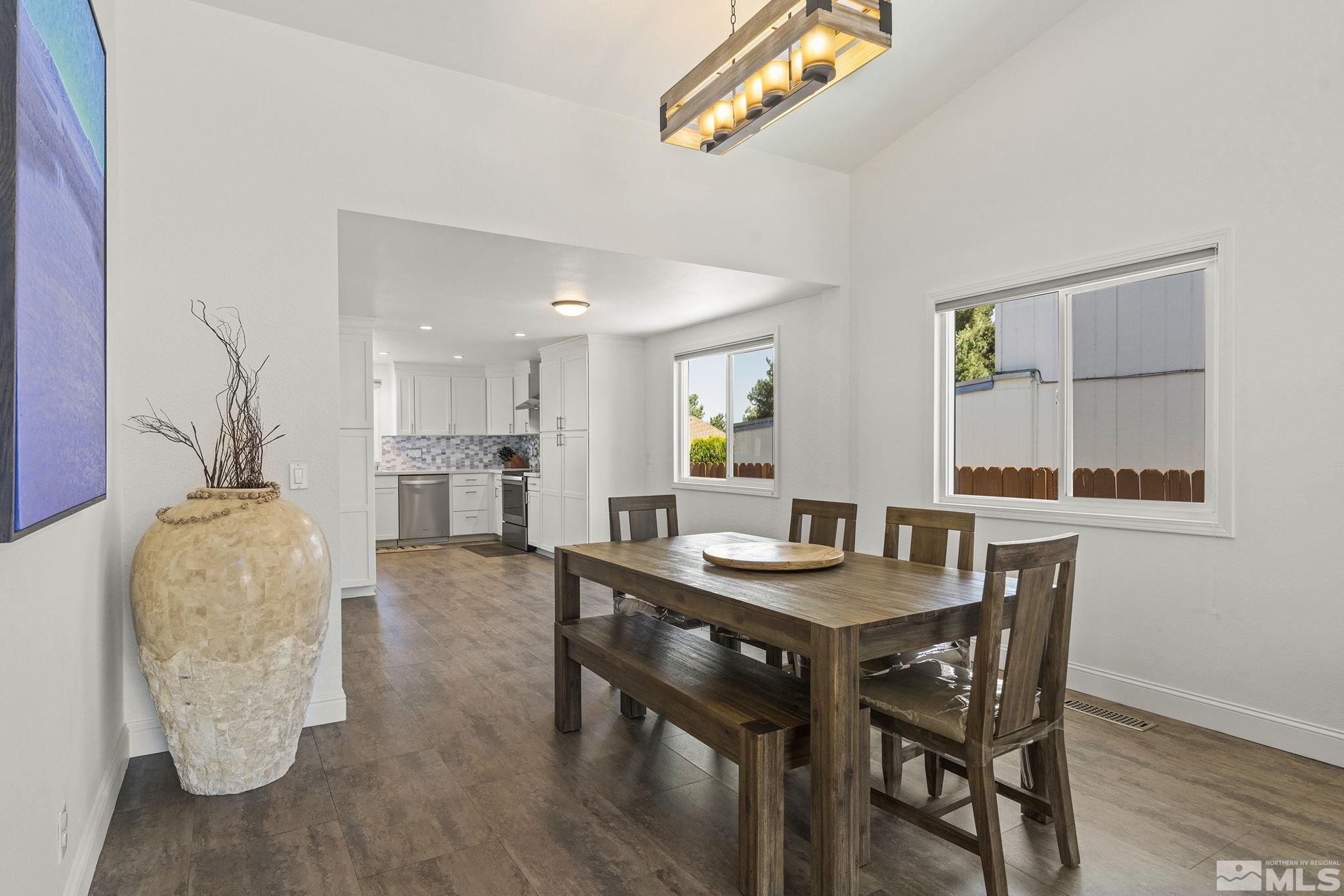 915 Pinebrook Road Reno, NV 89509 - Photo 9 of 29 a view of a dining room with furniture and wooden floor