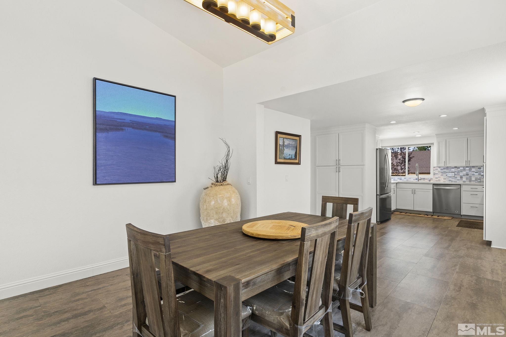 915 Pinebrook Road Reno, NV 89509 - Photo 10 of 29 a view of a dining room with furniture and wooden floor