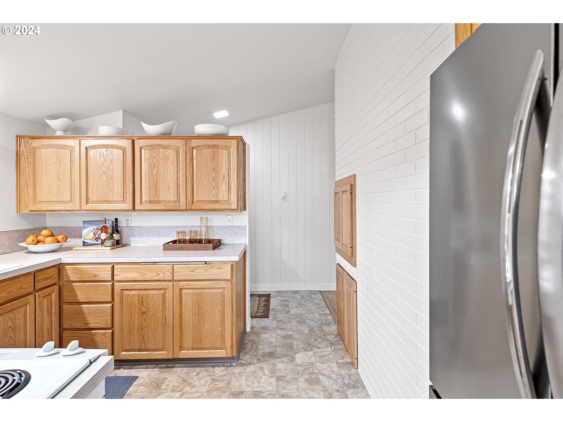 494 Winston Place Springfield, OR 97477 - Photo 18 of 48 a kitchen with stainless steel appliances granite countertop a refrigerator and a stove top oven