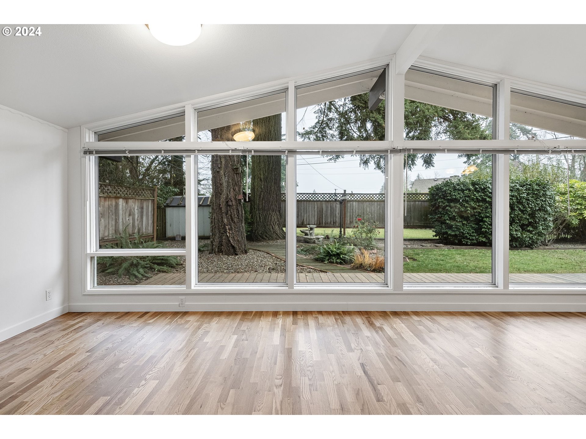 494 Winston Place Springfield, OR 97477 - Photo 19 of 48 a view of outdoor space with wooden floor and large window