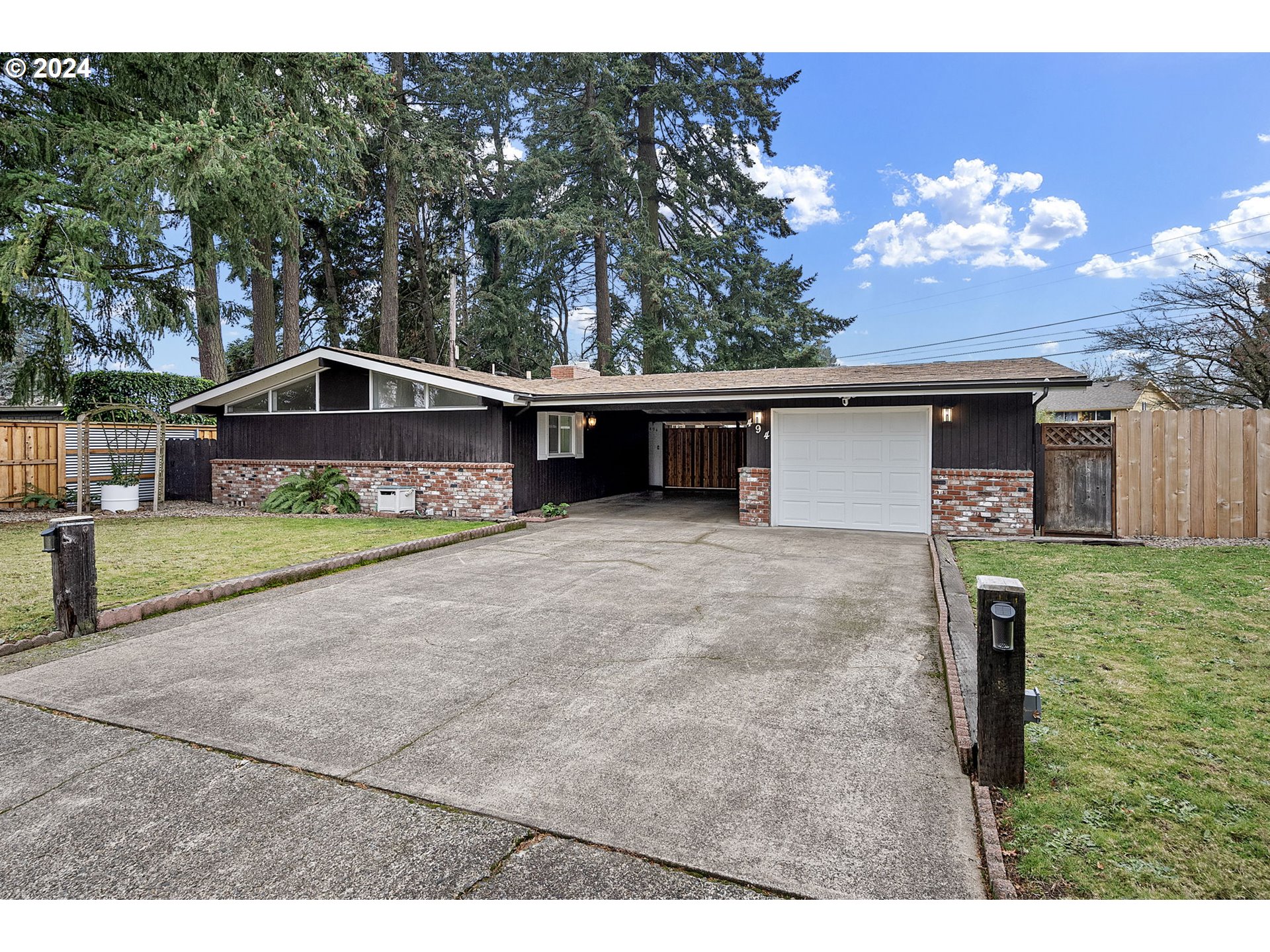 494 Winston Place Springfield, OR 97477 - Photo 2 of 48 a front view of a house with a yard and garage