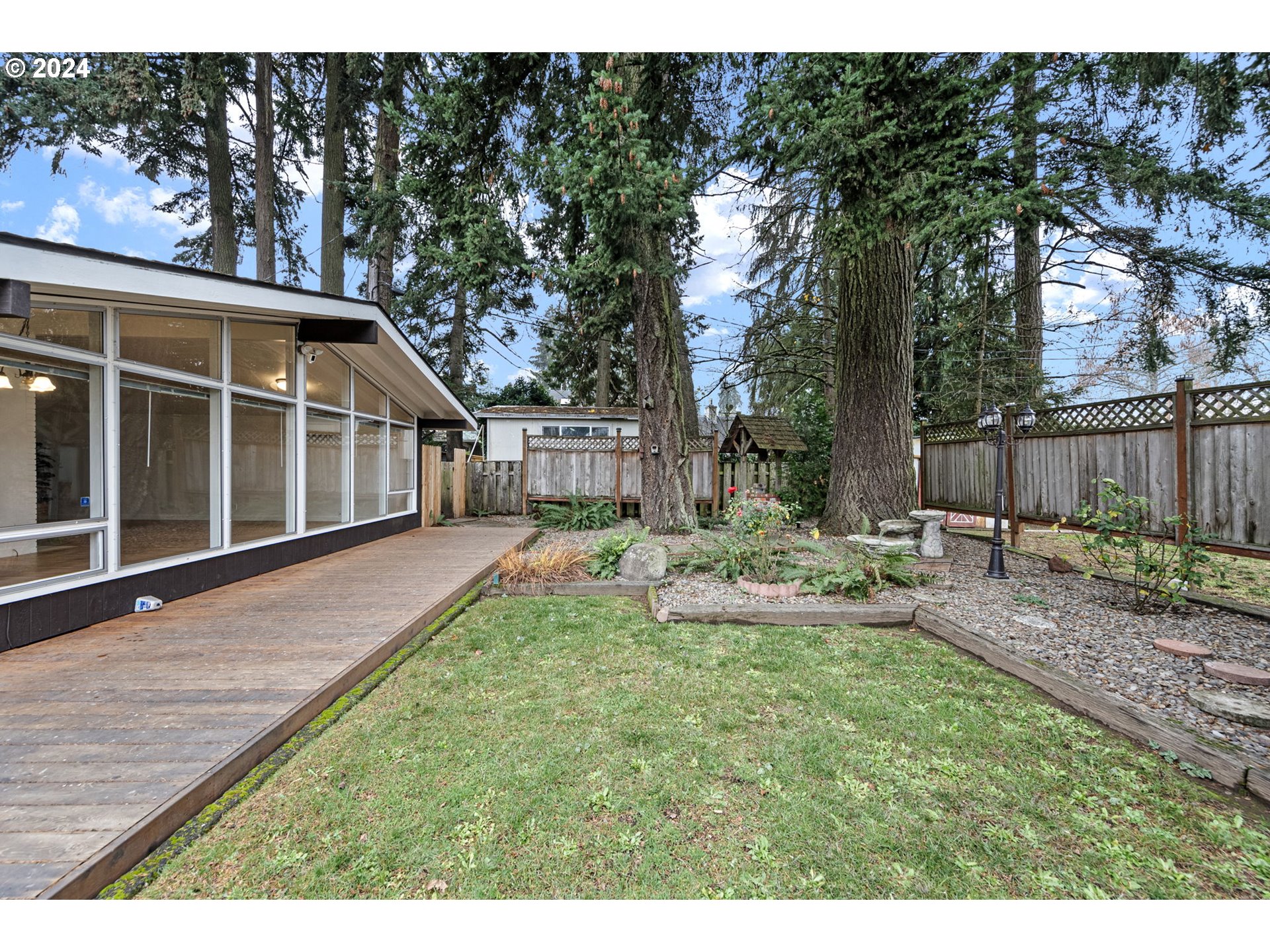 494 Winston Place Springfield, OR 97477 - Photo 21 of 48 a view of a house with backyard and sitting area