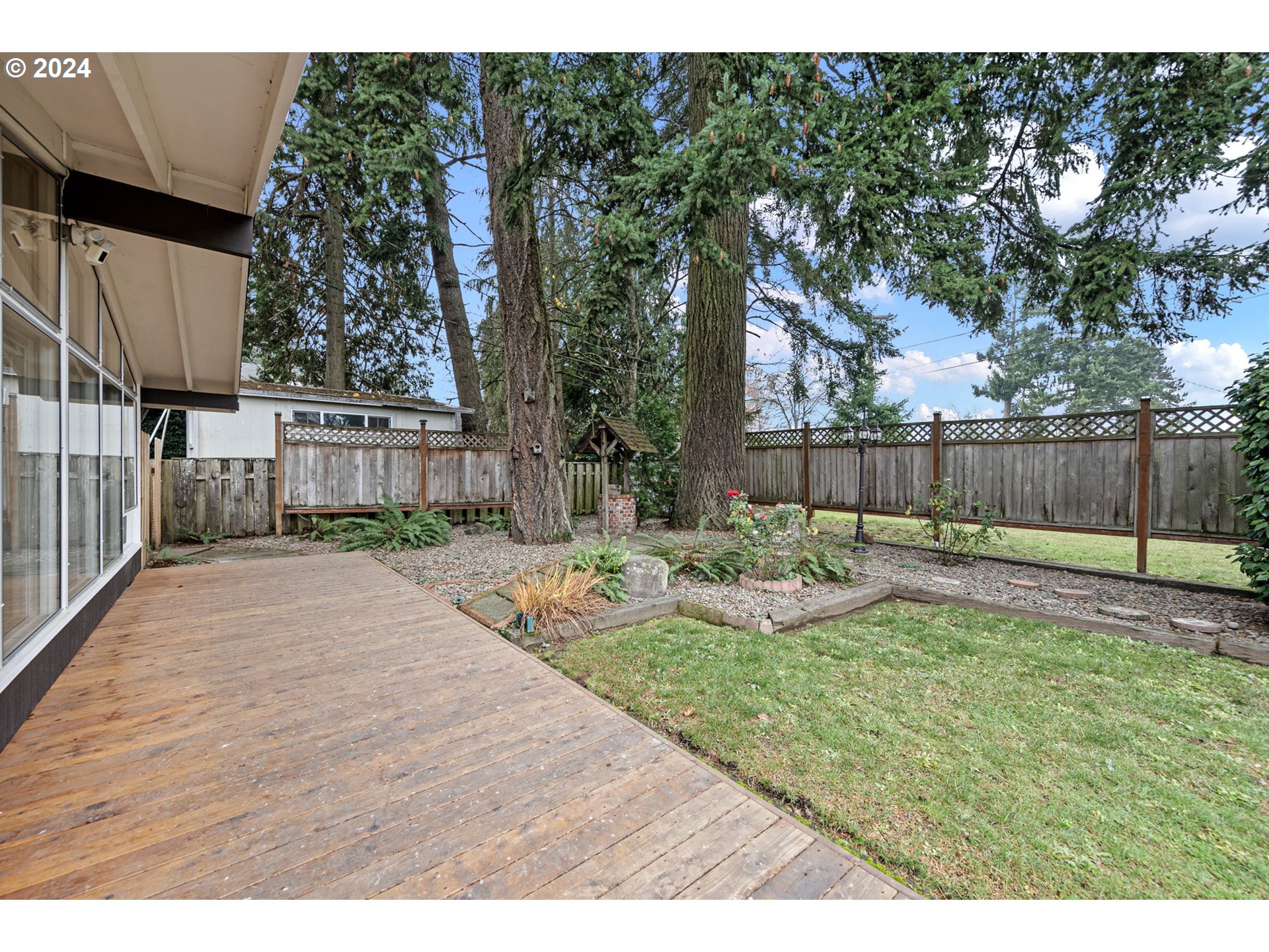 494 Winston Place Springfield, OR 97477 - Photo 41 of 48 a view of a house with backyard and a tree