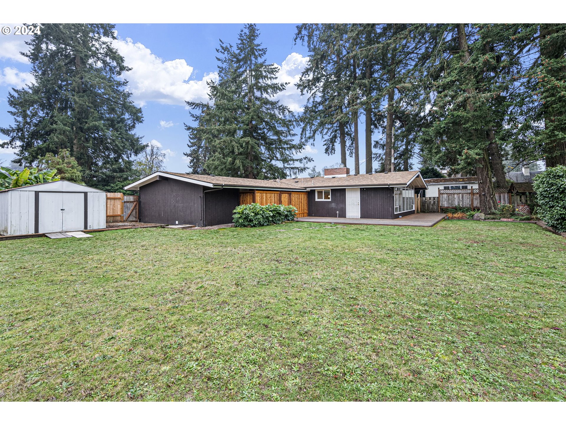 494 Winston Place Springfield, OR 97477 - Photo 44 of 48 a view of a house with a yard and sitting area
