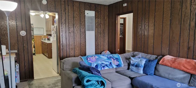 a bedroom with furniture and a wooden door
