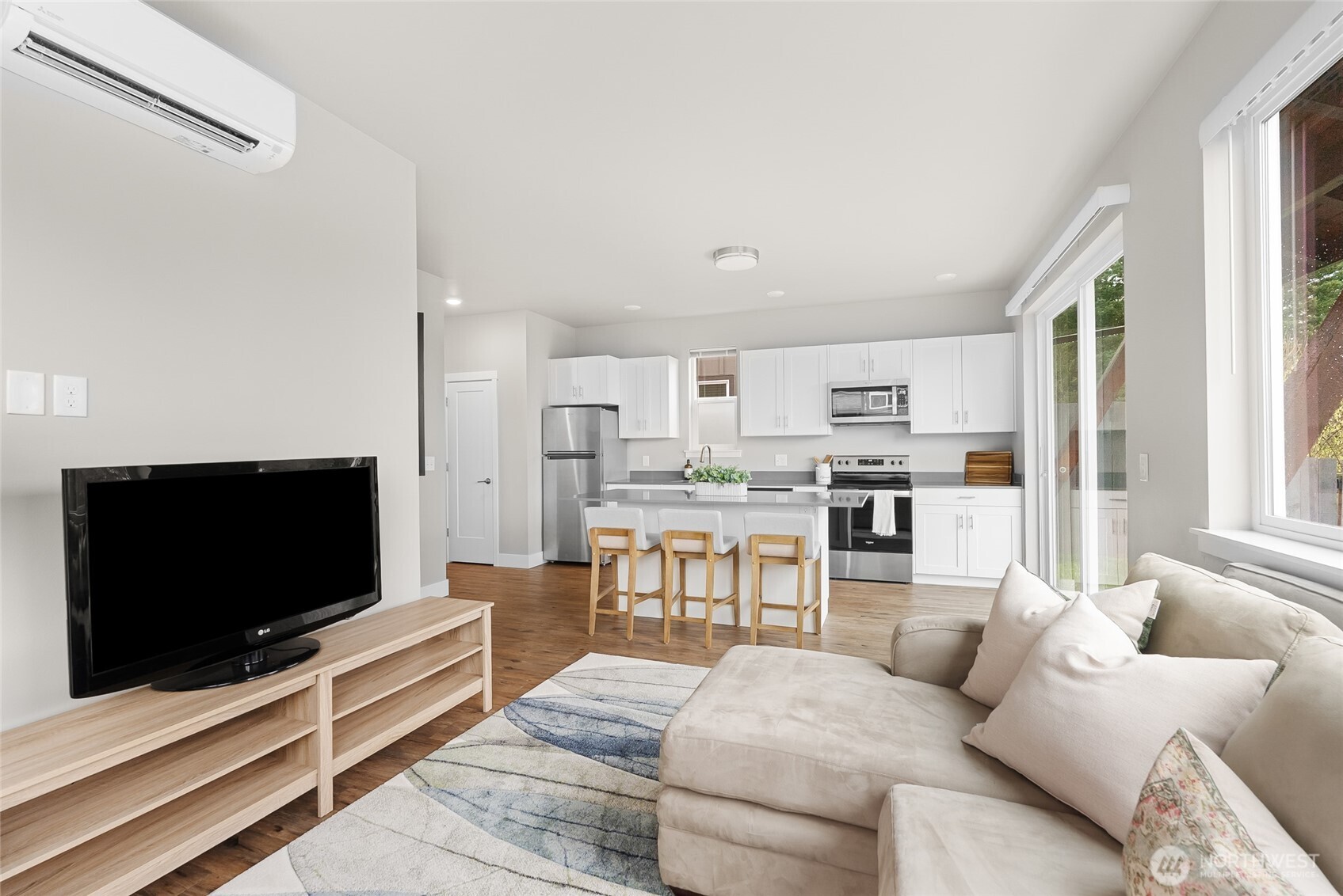 1884 Front Street, Unit A Lynden, WA 98264 - Photo 14 of 35 a living room with furniture and a flat screen tv