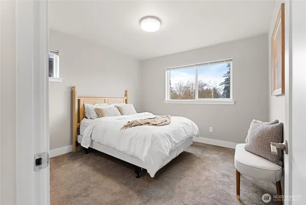 a bedroom with a bed and window