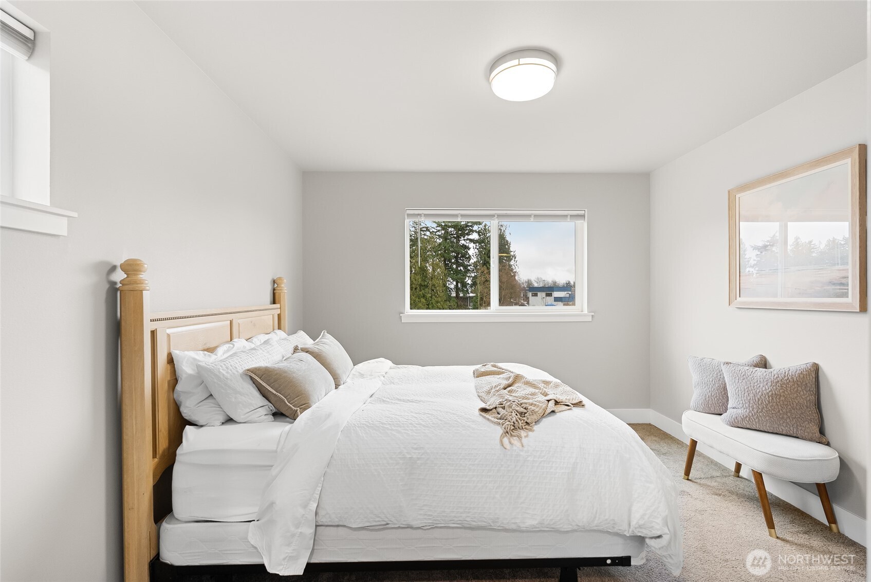 1884 Front Street, Unit A Lynden, WA 98264 - Photo 18 of 35 a bedroom with a bed and chair