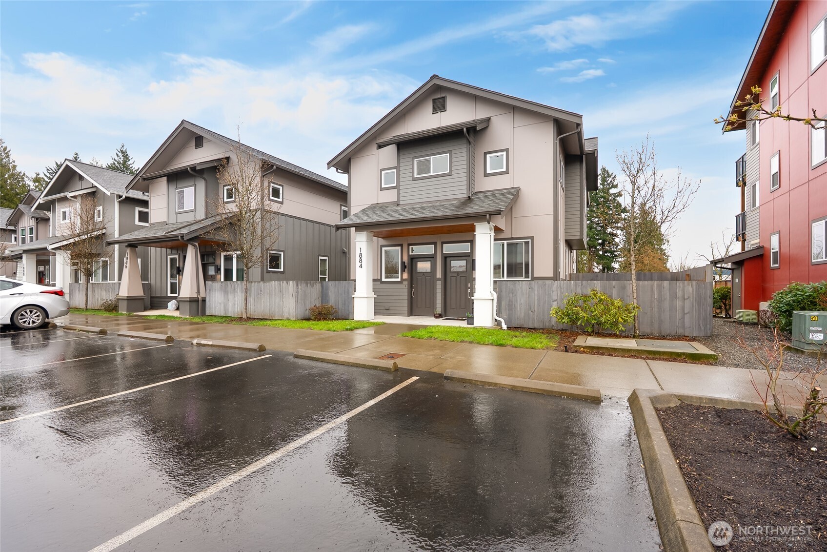 1884 Front Street, Unit A Lynden, WA 98264 - Photo 2 of 35 a view of a white house with a large windows next to a road