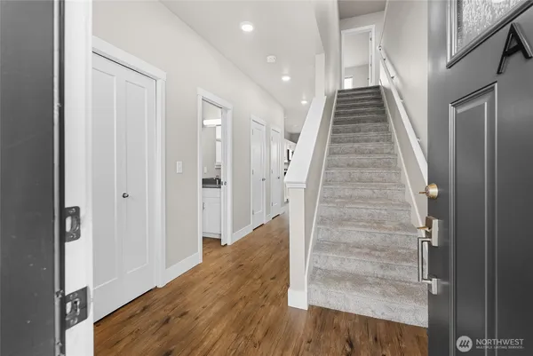 a view of entryway with wooden floor