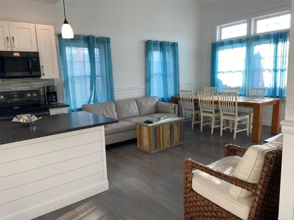 a living room with furniture fireplace and flat screen tv