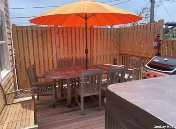 a view of a patio with a table and chairs