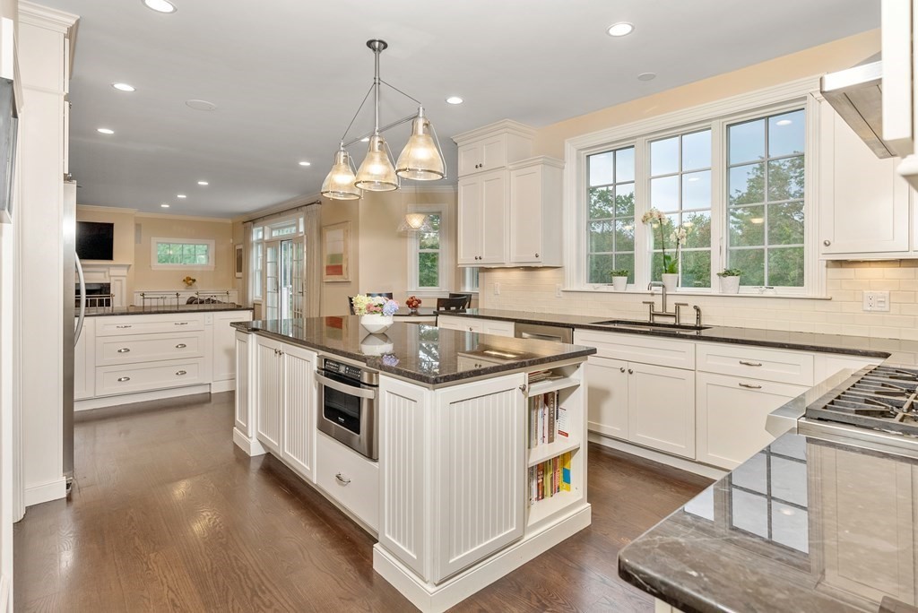 4 Fields Lane Wayland, MA 01778 - Photo 11 of 39 a kitchen with stainless steel appliances granite countertop a sink stove and cabinets