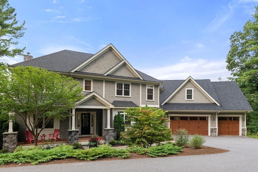 4 Fields Lane Wayland, MA 01778 - Photo 2 of 39 a front view of a house with a yard